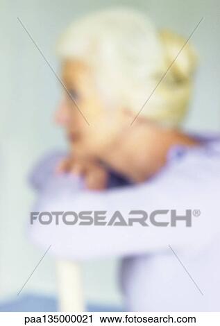 Stock Image - Mature woman, side view, blurred. Fotosearch