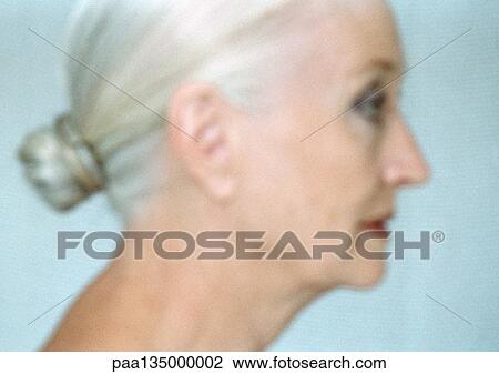Stock Image - Mature woman, side view, close-up, portrait. Fotosearch