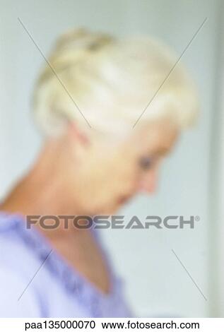 Mature woman, side view, close-up, portrait, blurred View Large Photo Image Stock Image - Mature woman, side view, close-up, portrait, blurred. Fotosearch