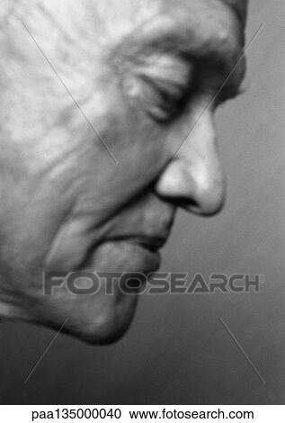 Senior man looking down, side view, close-up, b&w View Large Photo Image Stock Image - Senior man looking down, side view, close-up, b&w. Fotosearch