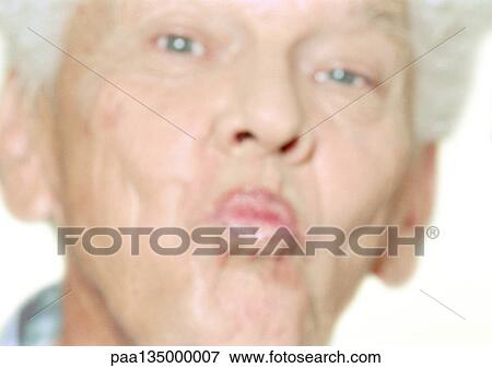 Senior man puckering lips, close-up, portrait View Large Photo Image Stock Photo - Senior man puckering lips, close-up, portrait. Fotosearch