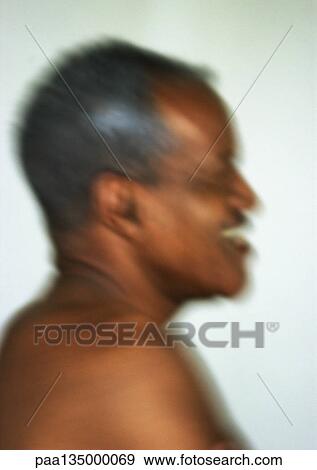Stock Photo - Senior man, side view, close-up, portrait, blurred. Fotosearch