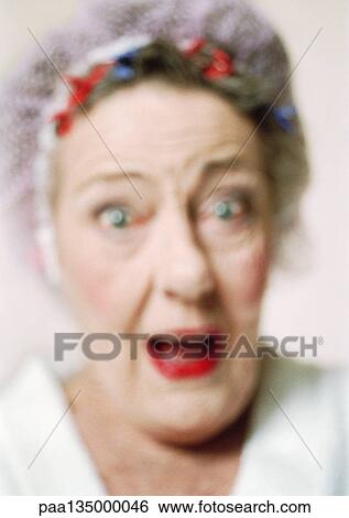 Stock Photograph - Senior woman, close-up, portrait, blurred. Fotosearch