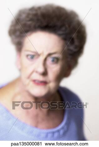 Senior woman making face, close-up, portrait, blurred View Large Photo Image Stock Image - Senior woman making face, close-up, portrait, blurred. Fotosearch