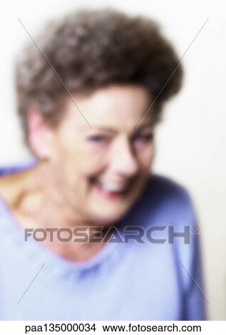 Picture - Senior woman smiling, close-up, portrait, blurred. Fotosearch