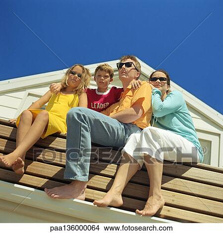 Picture - Family portrait, low angle view. Fotosearch