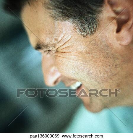 Mature man smiling, side view, portrait View Large Photo Image Stock Photo - Mature man smiling, side view, portrait. Fotosearch