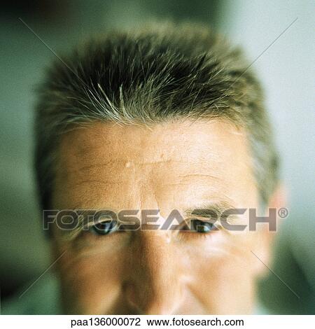 Stock Image - Partial view of man's face. Fotosearch