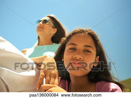 Picture - Portrait of girl and mother, low angle view. Fotosearch