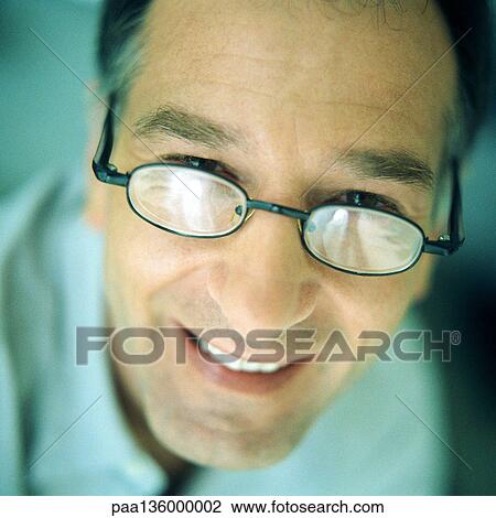 Portrait of man wearing glasses, close-up View Large Photo Image Stock Image - Portrait of man wearing glasses, close-up. Fotosearch