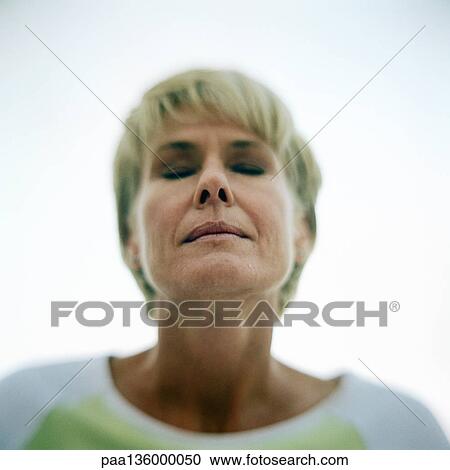 Portrait of mature woman, eyes shut View Large Photo Image Stock Image - Portrait of mature woman, eyes shut. Fotosearch