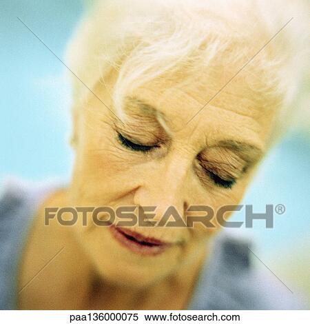 Portrait of senior woman with eyes shut View Large Photo Image Stock Photography - Portrait of senior woman with eyes shut. Fotosearch