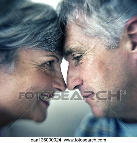 Profile of man and woman head to head with noses touching View Large Photo Image Picture - Profile of man and woman head to head with noses touching. Fotosearch