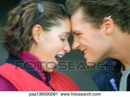 Profile of man and woman head to head with noses touching View Large Photo Image Stock Image - Profile of man and woman head to head with noses touching. Fotosearch
