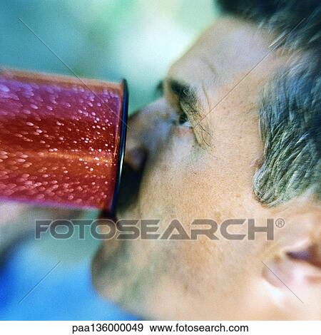 Profile of man drinking View Large Photo Image Stock Photo - Profile of man drinking . Fotosearch