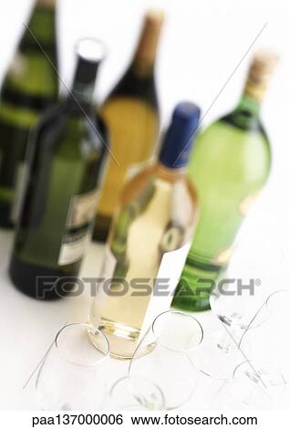 Bottles of wine and wine glasses View Large Photo Image Stock Photograph - Bottles of wine and wine glasses. Fotosearch