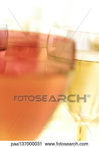 Stock Image - Cocktails, blurred, close-up.. Fotosearch