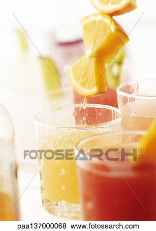 Stock Photo - Cocktails with orange slices, close-up.. Fotosearch