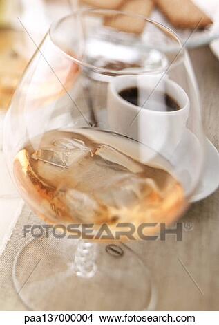 Cognac with ice cubes. View Large Photo Image Picture - Cognac with ice cubes.. Fotosearch