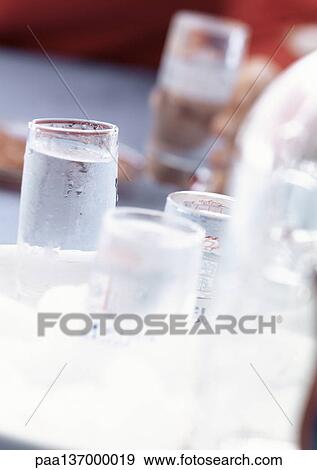 Four glasses of vodka View Large Photo Image Stock Photo - Four glasses of vodka. Fotosearch