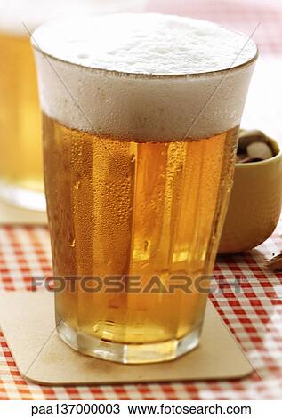 Stock Image - Glass of beer.. Fotosearch