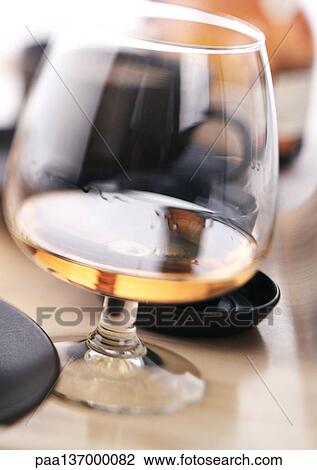 Glass of Cognac, close-up. View Large Photo Image Stock Image - Glass of Cognac, close-up.. Fotosearch