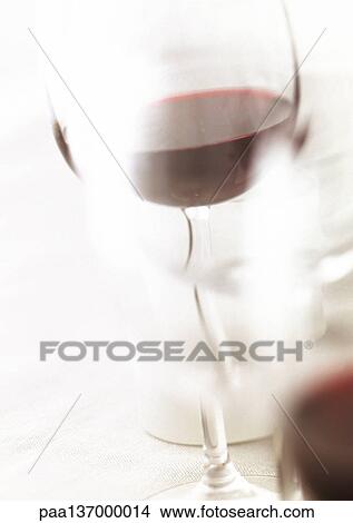 Glass of red wine, blurred. View Large Photo Image Picture - Glass of red wine, blurred.. Fotosearch