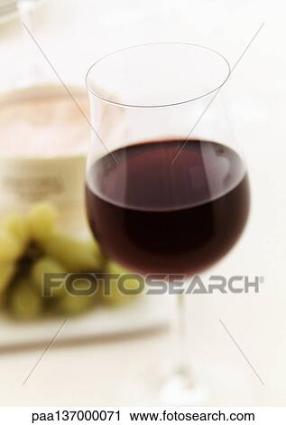 Glass of red wine, blurred. View Large Photo Image Stock Image - Glass of red wine, blurred.. Fotosearch