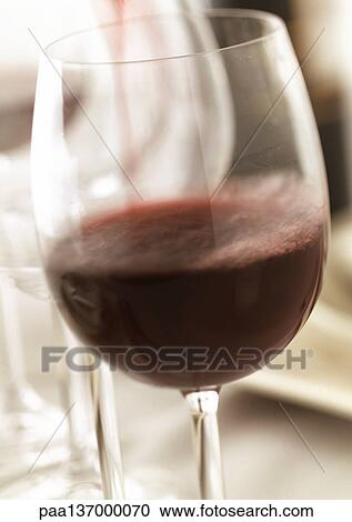 Glass of red wine, close-up. View Large Photo Image Stock Image - Glass of red wine, close-up.. Fotosearch
