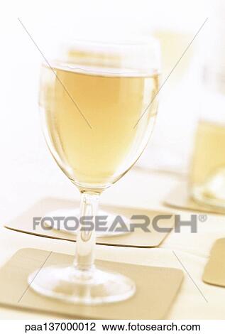 Stock Image - Glass of white wine.. Fotosearch