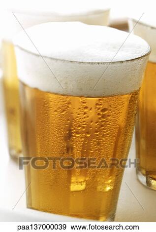 Stock Photo - Glasses of beer, close-up.. Fotosearch