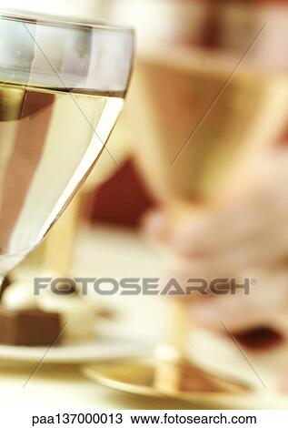 Glasses of white wine. View Large Photo Image Stock Image - Glasses of white wine.. Fotosearch