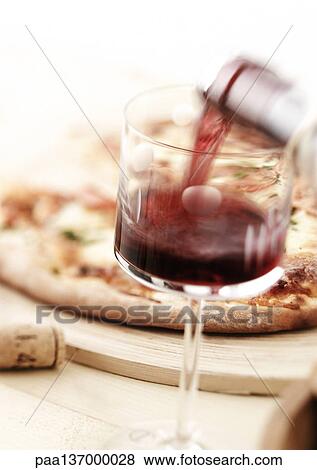 Stock Photo - Red wine and pizza.. Fotosearch