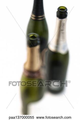 Three bottles of Champagne, blurred, elevated view. View Large Photo Image Stock Photography - Three bottles of Champagne, blurred, elevated view.. Fotosearch