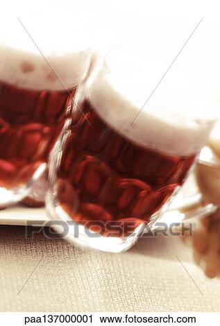 Stock Image - Two mugs of beer, close-up.. Fotosearch