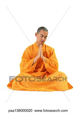 Buddhist monk sitting, meditating with hands together, front view View Large Photo Image Stock Image - Buddhist monk sitting, meditating with hands together, front view. Fotosearch