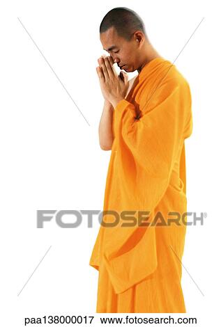 Buddhist monk standing, meditating View Large Photo Image Stock Photo - Buddhist monk standing, meditating. Fotosearch