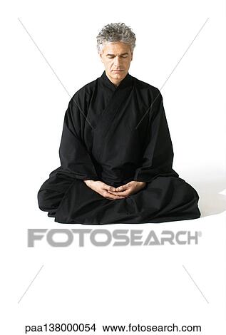 Man sitting on floor, meditating View Large Photo Image Picture - Man sitting on floor, meditating. Fotosearch