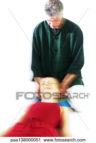 Massage therapist massaging woman's head, blurred View Large Photo Image Stock Image - Massage therapist massaging woman's head, blurred. Fotosearch