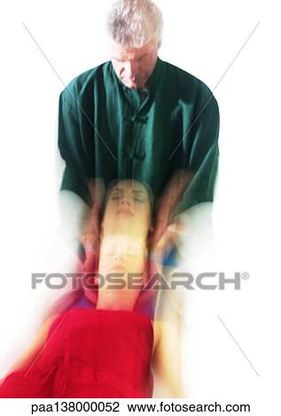 Massage therapist massaging woman's head, blurred View Large Photo Image Stock Image - Massage therapist massaging woman's head, blurred. Fotosearch