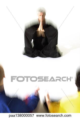 People sitting on floor in lotus position, meditating, blurred View Large Photo Image Stock Photo - People sitting on floor in lotus position, meditating, blurred. Fotosearch