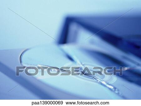 CD Rom Drive holding broken CD, close-up. View Large Photo Image Stock Photo - CD Rom Drive holding broken CD, close-up.. Fotosearch