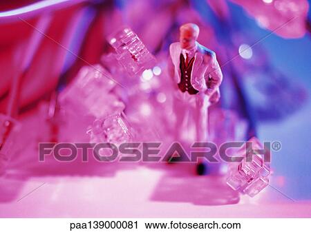 Small toy figure next to computer plugs. View Large Photo Image Stock Image - Small toy figure next to computer plugs.. Fotosearch