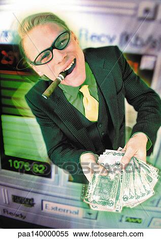 Stock Illustration - Businessman holding pile of cash, emerging from computer monitor, digital composite.. Fotosearch