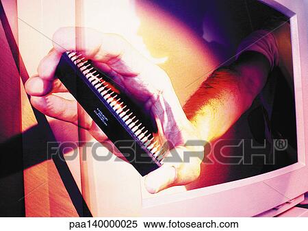 Stock Illustration - Hand emerging from computer monitor, holding circuit board, digital composite.. Fotosearch