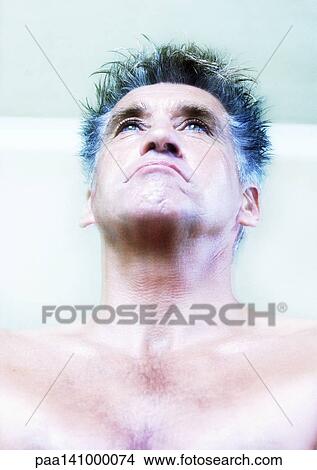 Mature man, bare-chested, head back, portrait. View Large Photo Image Picture - Mature man, bare-chested, head back, portrait.. Fotosearch