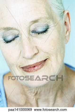 Mature woman smiling, eyes closed, portrait. View Large Photo Image Stock Photo - Mature woman smiling, eyes closed, portrait.. Fotosearch