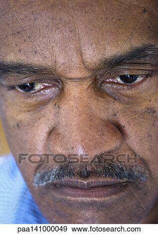 Senior man looking down, close-up. View Large Photo Image Stock Photo - Senior man looking down, close-up.. Fotosearch