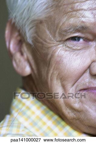 Senior man looking into camera, partial view, close-up. View Large Photo Image Stock Photo - Senior man looking into camera, partial view, close-up.. Fotosearch