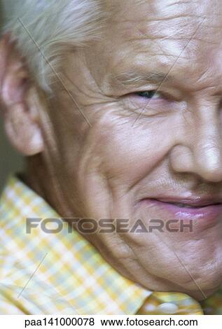 Senior man looking into camera, close-up of one side of face. View Large Photo Image Stock Photo - Senior man looking into camera, close-up of one side of face.. Fotosearch
